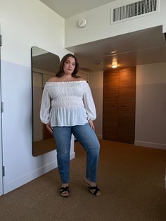 The Plus Size Off The Shoulder Boho Top is a simple and trendy off-shoulder top that needs to be a part of every plus size girl's collection. This off-shoulder top currently comes in three different colors: white, black, and blue. This smocked, off-the-shoulder top features ruffled hems and long sleeves with elastically cinched wrists. The smocked detailing makes up most of the torso of the top and lends to a flattering, dynamic shape. This top is made from 75% rayon and 25% nylon. Hand wash col Plus Size Off The Shoulder, White Boho Tops, Boho Top, Off The Shoulder Top, Off Shoulder Tops, Boho Tops, Ruffle Hem, Smocking, Shoulder Top