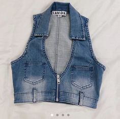 a denim vest with zippers on the front and an inscription that says, i am mama