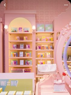 a store with pink walls and shelves filled with items