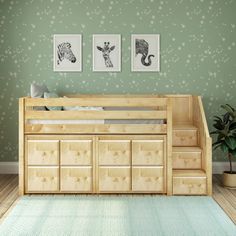 there is a bed with drawers underneath it and two pictures on the wall above it