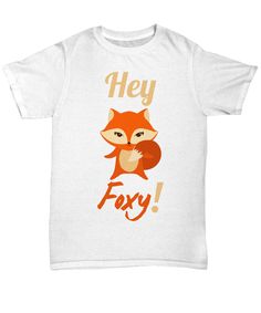 a white t - shirt with an image of a fox and the words hey, fox