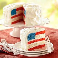 a piece of cake with red, white and blue frosting is on a plate