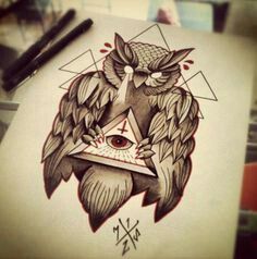 an owl and triangle tattoo design on paper