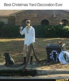 a woman standing in front of a trash can with a dog sitting on the ground