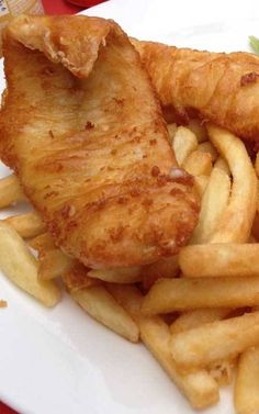 fried fish and fries on a white plate