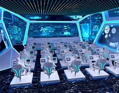 a large room filled with lots of computer desks covered in blue and white chairs