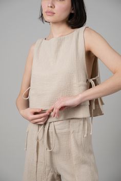 Looking for a genuine super soft and everyday top? Designed in a light silhouette, sleeveless Mia Side Ties Top can be worn with ease all summer long and compliments most body types with adjustable side-ties. - 100% Turkish double layered gauze cotton - Side slits tied with adjustable side-ties.- Crop top finish at waist Summer Cotton Top With Tied Details, Sleeveless Cotton Crop Top With Tie Back, Linen Tie Front Top, Summer Halter Top With Adjustable Tie-side, Linen Tie Back Crop Top, Tie Crop Top, Tie Top, Body Types, Aesthetic Art