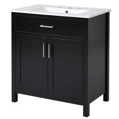 a bathroom vanity with a white sink and black cabinet