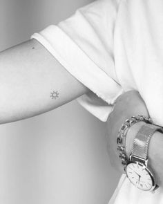 Minimalist sun tattoo on the inner arm Small Minimalist Sun Tattoo, Minimalist Tattoos On Arm, Subtle Sun Tattoo, Mini Tats Sun, Small Arms Tattoos, 3 Suns Tattoo, Minimalist Sun Tattoo Simple, Small Tattoos Inside Arm, Beautiful Minimalist Tattoo