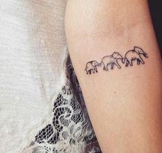 three elephants tattoo on the arm