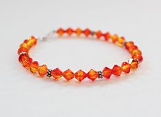 This beautiful orange crystal bracelet is handcrafted by me. Perfect orange bridesmaid or prom jewelry! Fire opal 6mm Swarovski crystals and Bali sterling silver are showcased in this bracelet. Perfect gift for an orange lover! Handmade by me in my smoke-free home. I represent the colors in photos as closely as possible. Please be aware that all monitors differ. I ship via USPS first class mail worldwide. Check out my other designs! http://www.etsy.com/shop/LeaningTreeDesigns Thanks for stopping Jewelry Valentines Day, Orange Accessories, Orange Bridesmaid, Orange Jewelry, Orange Bracelet, Fairy Jewelry, Orange Crystals, Prom Jewelry, Orange Wedding