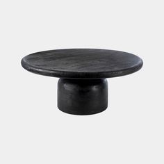 a black round table on a white background