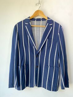 Tomorrowland Navy Striped Shirt & Jacket Set! 100% cotton. The jacket has a two-button front and single vent in the back. Unlined. Size medium, please refer to measurements. In excellent condition! Approx. Measurements: Shirt: U: 21" L: 25" Jacket: U: 20.5" A: 24" L: 26" Tailored Cotton Outerwear With Suit Collar, Cotton Outerwear With Button Closure And Suit Collar, Business Cotton Outerwear With Long Sleeves, Classic Cotton Button-up Sport Coat, Classic Blue Cotton Sport Coat, Tailored Button-up Cotton Blazer, Tailored Cotton Button-up Blazer, Tailored Striped Outerwear With Lapel Collar, Fitted Cotton Button-up Blazer