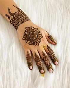 hendi tattoos on the palm of a woman's hand