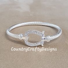 Horseshoe cuff bracelet silver plated with cz crystal detail. Comes boxed Great gift matching accessories available  If you haven't seen a design that completely suits what you're looking for then please take a look at my other items or message me and I will do my best to create it for you. or see our website countrycraftydesigns.co.uk Equestrian Gifts, Country Wear, Feather Hat, Matching Accessories, Silver Cuff Bracelet, Bracelet Silver, Charm Bracelets, Silver Bracelets, Cuff Bracelet