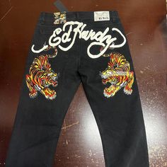 Ed Hardy Mens Black Tattoo 5 Pocket Design Distressed Denim Slim Tapered Jeans Available In The Following Sizes 1- 40 1- 42 Ed Hardy Designs, Jean Pocket Designs, Slim Tapered Jeans, Ed Hardy Jeans, Sagging Pants, Black Tattoo, Jean Pockets, Nike Air Max Tn, Crochet Halter Tops