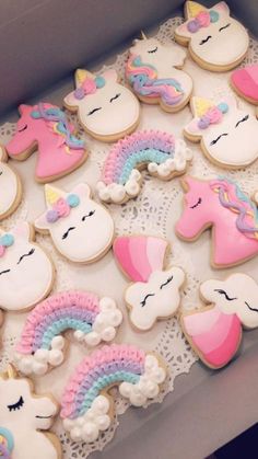 decorated cookies in the shape of unicorns and horses