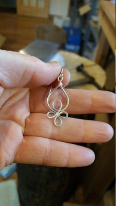 "We designed, hammered and swirled 18 gauge sterling silver wire to handmake these original light weight Celtic influenced earrings. The earrings measure about 1 1/4 - 1 5/8 \"(3.3 - 4.2 cm) from the top loop to the bottom . The silver earwires add about 1/2\". They measure about 5/8 - 3/4\" (1.6 - 2cm) across the widest part of the earrings. This design is available in a smaller version with a dangling stone bead called Little Celtic Loops Sterling Silver and Iolite Earrings in the Sterling Sil Freeform Sterling Silver Earrings As Gift, Sterling Silver Freeform Earrings As Gift, Earrings Celtic, Silver Wire Jewelry, Silver Wire Earrings, Celtic Knot Earrings, Aluminum Earrings, Celtic Earrings, Wire Work Jewelry