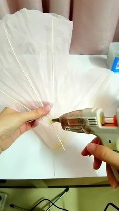 someone is cutting paper with a pair of scissors