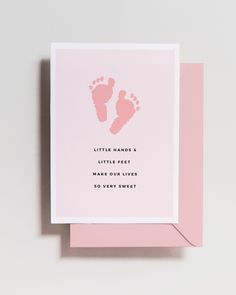 a pink card with the words, little hands and a baby feet print on it