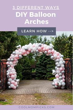 a large arch made out of balloons on a brick walkway