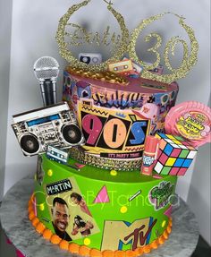 there is a cake that has various items on it and the words 30th birthday written in large letters