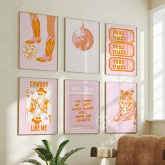 a living room with posters on the wall and a chair in front of it next to a potted plant