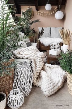 a balcony with plants and wicker baskets on the floor