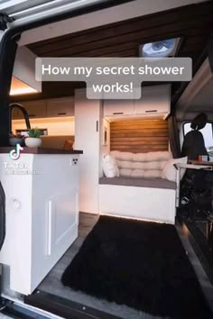 the interior of a camper van with its door open to show it's kitchen