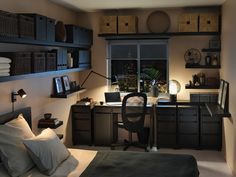 a bedroom with a bed, desk and bookshelves in front of a window