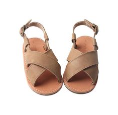 ***Looking for a smaller size? Click HERE to see this same style with smaller sizes in a soft sole.*** Our sandals are easy to dress up or down making them the best accessory. These cute sandals are just what your little one needs this summer! Genuine leather statement shoe Leather lining Rubber hard sole provides grip, stability, and comfort to young walkers. Gold buckle accented strap backed with elastic for easy fit and comfortable wear Handy heel strap makes sliding tiny toes into these shoe Soft Sole Baby Shoes, Trendy Boy Outfits, Statement Shoe, Children's Boutique, Cute Sandals, Digital Gifts, Same Style, Velcro Straps, Walkers