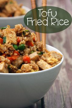 two bowls filled with fried rice and vegetables