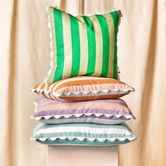 four pillows stacked on top of each other