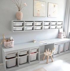 a child's playroom with toys and storage bins on the wall next to it