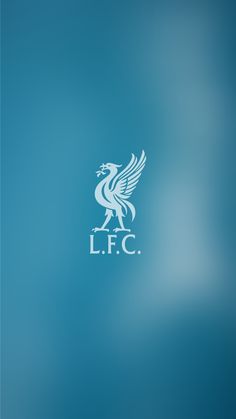 the liverpool city logo is shown on a blurry blue background with white letters that read lfc