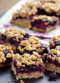 blueberry crumb bars cut into squares on a tray