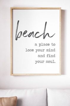 a black and white print with the words beach in cursive writing on it