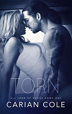 the cover for torn by caran cole, with an image of a man and woman kissing