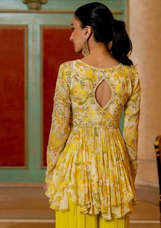 Featuring the lime yellow geometric floral printed peplum set with antique gold dori, embellished hand work and beautifully adorned using tassels, it is paired with palazzo pants. Yellow Anarkali Palazzo Set With Printed Motifs, Anarkali Sets With Printed Motifs In Yellow, Yellow Embellished Designer Wear Sets, Designer Yellow Embellished Sets, Yellow Georgette Sets With Printed Motifs, Yellow Floral Print Anarkali Set For Festivals, Designer Yellow Floral Anarkali Set, Yellow Floral Anarkali Set For Festivals, Festive Yellow Sharara With Printed Motifs