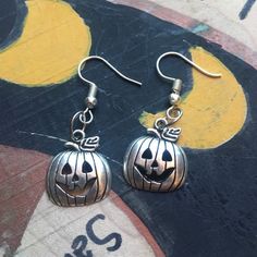 ✨Elegant and simple pumpkin charm earrings.  ✨They measure about 1 inches  Questions? Send me a message! ❤ Shipping & Payment Policies:; https://www.etsy.com/shop/VenaRicoDesigns/policy?ref=shopinfo_policies_leftnav To add gift wrap to your order, click the link below:; https://www.etsy.com/listing/151186034/gift-wrap-your-purchase Spooky Nickel-free Silver Earrings, Spooky Silver Nickel-free Earrings, Spooky Silver Earrings For Gift, Spooky Hypoallergenic Jewelry For Halloween, Spooky Silver Dangle Earrings, Handmade Sterling Silver Halloween Earrings, Nickel-free Sterling Silver Witchy Earrings, Nickel Free Sterling Silver Witchy Earrings, Adjustable Nickel-free Earrings For Halloween