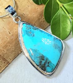 "Natural Hiigh Grade Arizona Kingman Turquoise Freeform Handmade .925 Sterling Silver Pendant 2 1/8\" x 1 1/8\" 11.2 grams FU07. This is a handpicked natural stone, the exact one shown in picture.  The sterling silver is .925 and stamped.  Each piece is hand made by artisans in my shop.  The quality of the stones and the silver workmanship is impressive.  Please look at other items in my store.  I sell ready made jewelry with hand crafted silver work, pendants with a sterling silver bails and beautiful unique stones for jewelry wire wrapping and weaving. You will pay exact amount on shipping plus $1 for supplies and labor. All items are shipped within a couple of days after payment and are shipped USPS first class or international first class.  Items are available for combined shipping, if Blue Turquoise Necklace With Large Chrysocolla Pendant, Turquoise Necklace With Large Chrysocolla Pendant, Blue Turquoise Chrysocolla Necklace With Large Pendant, Artisan Blue Turquoise Necklace Untreated, Arizona Turquoise, Boho Pendant, Made Jewelry, Silver Work, Kingman Turquoise