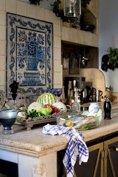 an iphone photo of a kitchen with blue and white decor on it's walls