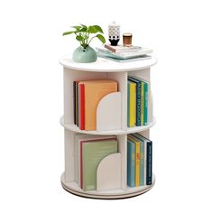 a white shelf with books and a plant on top