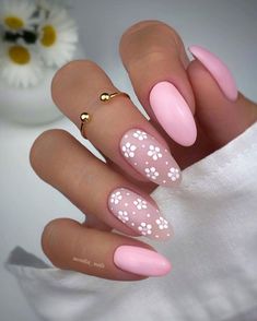 a woman with pink and white nail polish on her nails