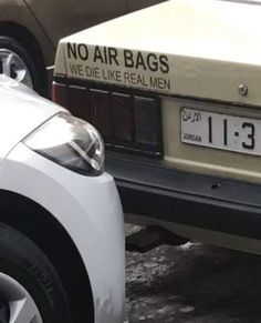 two cars parked next to each other in a parking lot with no air bags on the back