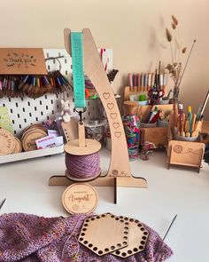 some crafting supplies on a table with scissors and other things to make it look like they are made out of wood