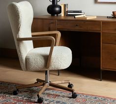 an office chair sitting in front of a desk with a lamp on top of it