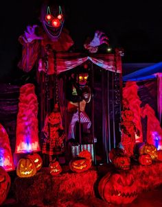 halloween decorations are lit up in the dark