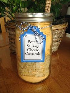 a jar filled with cheese sitting on top of a wooden table