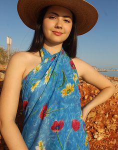 Beach sarong in pale blue with multi colour floral print. One size. Size: 42"(107cm) x 64"(162cm) Multi use, wear as a sarong, beach cover up or use as a beach towel. Lightweight fabric. Composition: Mixed Sustainability: Vintage Bohemian Printed Sarong For Pool, Hawaiian Floral Print Sarong For Beach, Tropical Floral Print Sarong For Beach Cover-up, Tropical Floral Print Sarong For Beach, Hawaiian Floral Print Sarong For Beach Season, Multicolor Floral Print Sarong For Beach Season, Multicolor Floral Print Beach Sarong, Bohemian Floral Print Sarong For Spring, Spring Bohemian Floral Print Sarong